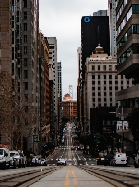 City scape with tall buildings and a narrow road