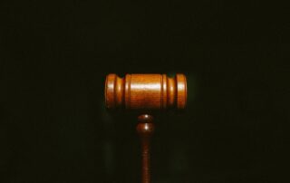 gavel on a black background - Wrongful Death Claim